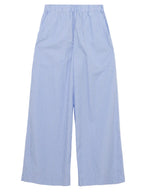 The Arden Pull On Pant by Simkhai features light blue and white vertical stripes, a wide leg silhouette, lightweight cotton fabric, and an elastic waistband, shown on a white background.