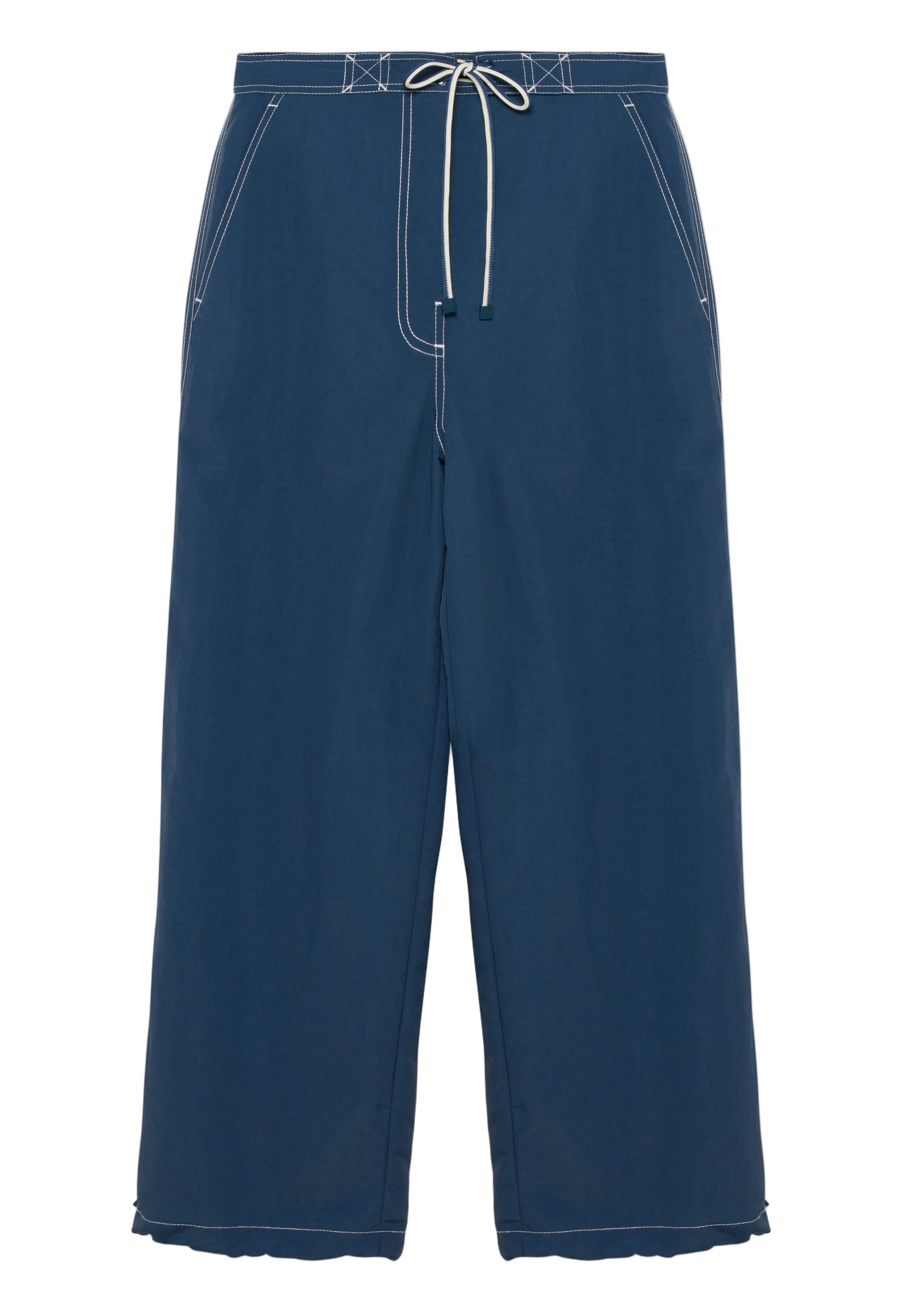 The Simkhai Lennox Cotton Straight Leg Pant features side pockets, white contrast stitching, and an adjustable drawstring waistband, shown in dark indigo against a white background.
