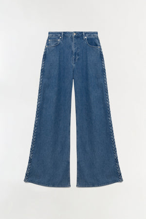The Simkhai Booker Straight Jean features wide-leg blue premium denim with braided outer seam detailing and classic 5-pocket construction, shown flat on a light background.