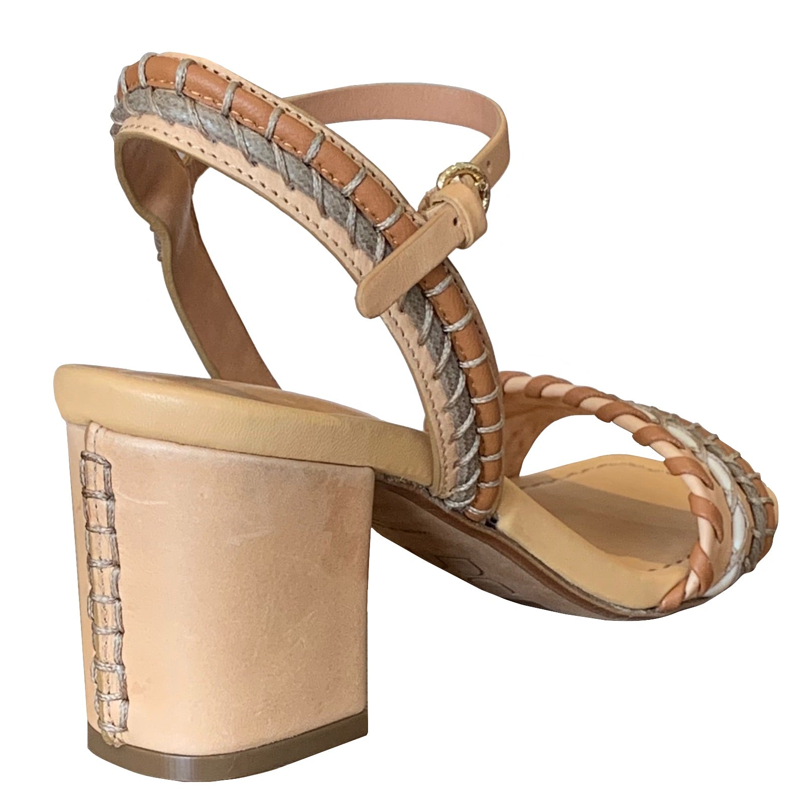 A single Ulla Johnson Sofia Sandal in tan and beige, featuring a block heel and woven strap design, viewed from the rear angle to highlight the ankle strap and stitching details in vegetable-tanned leather.