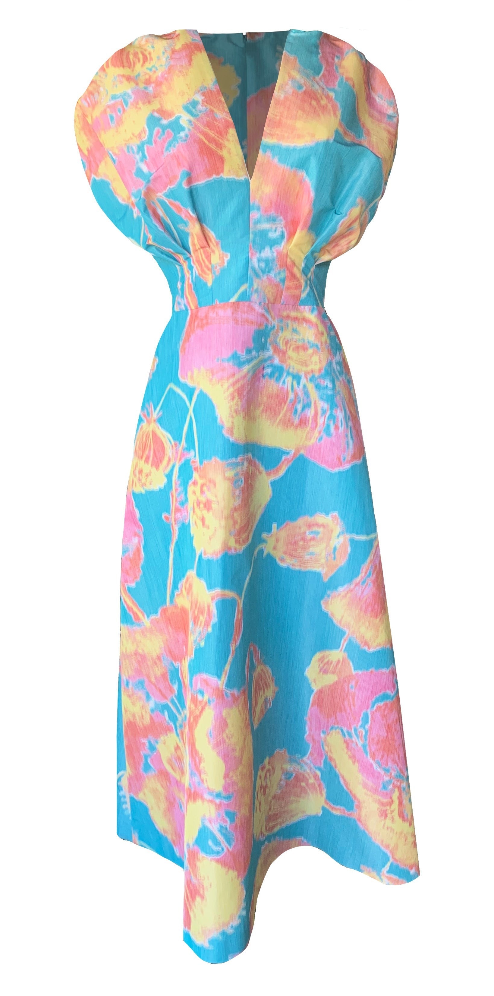 The Lela Rose Isabel Dress is a knee-length piece with a vibrant, painterly print of yellow, pink, and orange flowers on a blue background. It features a deep V-neckline and short, puffed sleeves with a fitted waist for an elegant silhouette.