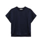 The Simkhai Addy Satin T-Shirt features a relaxed fit, short sleeves, and a classic crew neckline in navy blue, shown against a white background.