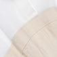 Close-up of the Simkhai Sundae Linen Mini Dress in white, featuring a collared neckline and structured beige bodice with visible seams.