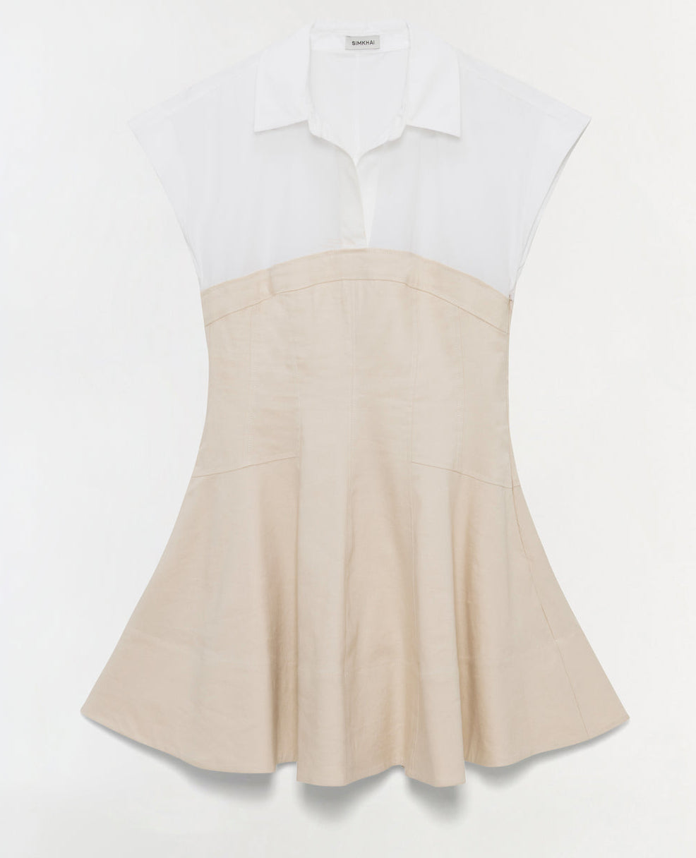 The Simkhai Sundae Linen Mini Dress features short sleeves, a structured white collared top, and a flared beige skirt, all displayed against a plain white background.