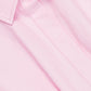 Close-up of the Clemmie Mini Dress by Simkhai in light pink, featuring a collared neckline, visible collar, button detail, and central seam with prominent stitching.