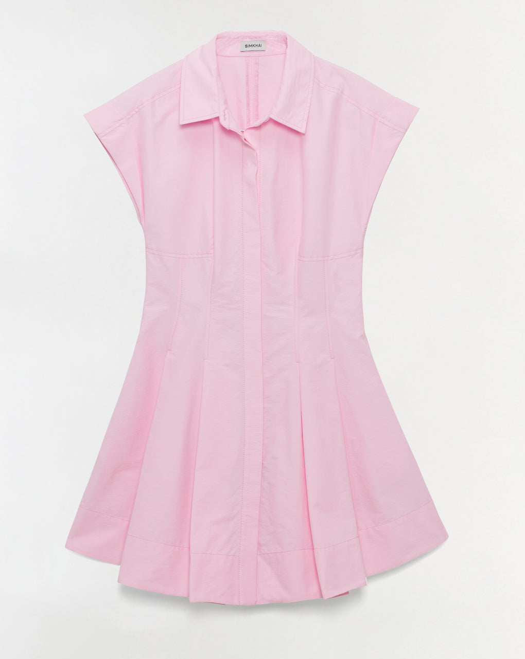 The Clemmie Mini Dress by Simkhai is a light pink cotton mini dress with a collared neckline, short sleeves, and a flared pleated skirt with a concealed button-down front, shown against a plain white background.