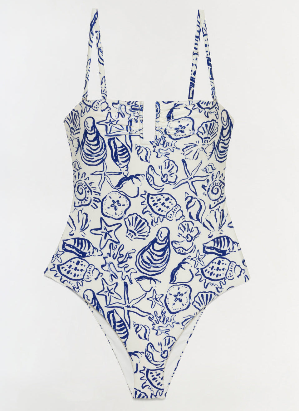 The Simkhai Ottilie Strapless One Piece features a blue seashell and marine life print on white, with a square neckline and adjustable shoulder straps.