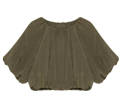 The Simkhai Anni Puff Sleeve Cropped Top features a loose fit, short puff sleeves, gathered neckline, and olive green crinkled fabric for textured style.
