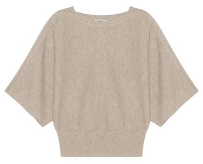 The Shai Tee by Simkhai is a beige, short-sleeved sweater featuring dolman sleeves, a wide neckline, loose fit, and ribbed waistband for a relaxed boxy silhouette.