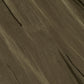 Close-up of Simkhai's Freya Parachute Pant fabric, showcasing visible seams and a textured, slightly wrinkled brown surface.