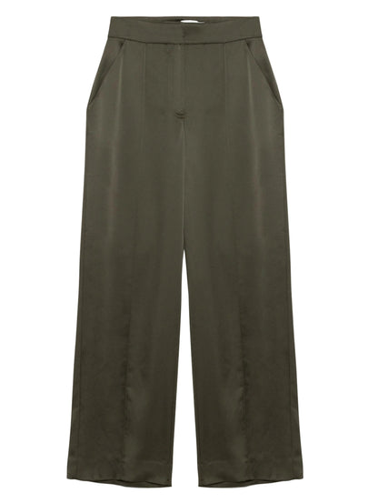The Simkhai Kyra Wide Leg Pant in olive green features a high waist, tailored waistband, front pleats, side pockets, and a relaxed silhouette crafted from smooth, slightly shiny satin.