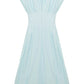 The Simkhai Farlow Dress is a light blue cotton faille, short-sleeve, collared midi dress with a front zipper and pleated skirt, shown laid flat on a white background.