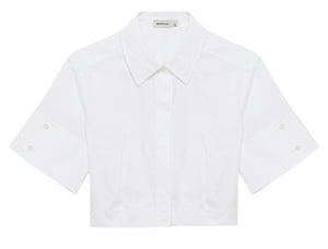 The Simkhai Sabrina Top, a white cropped button-down with short sleeves, collared neckline, and classic tailoring, is shown on a white background.