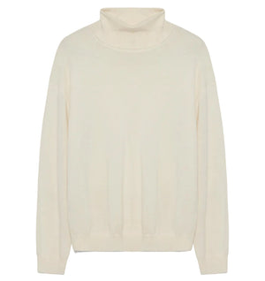 The Aaliyah Knit Turtleneck by Simkhai is a cream-colored, long-sleeve ivory sweater with ribbed cuffs and hem, shown laid flat on a white background. This lightweight knit provides timeless style and versatile appeal for any wardrobe.
