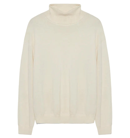 The Aaliyah Knit Turtleneck by Simkhai is a cream-colored, long-sleeve ivory sweater with ribbed cuffs and hem, shown laid flat on a white background. This lightweight knit provides timeless style and versatile appeal for any wardrobe.