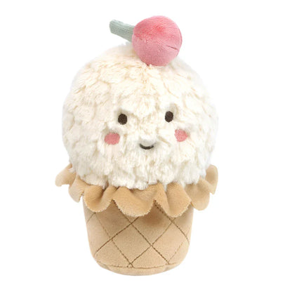 The MON AMI Izzy Ice Cream Chime Toy by Mon Ami is a sensory plush shaped like an ice cream cone, complete with a white scoop, a pink cherry on top, and a smiling face. Ideal as a baby activity toy, it entertains little ones with its soothing chime sound.