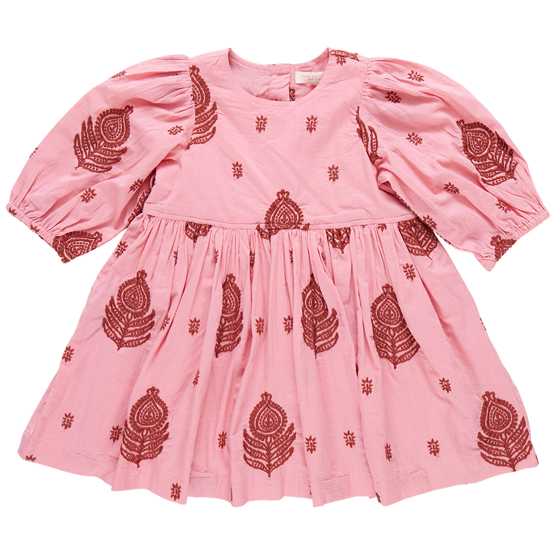 The Pink Chicken Girls' Embroidered Brooke Dress, featuring a beautiful pink color with three-quarter puff sleeves and an A-line skirt, is adorned with intricate red paisley and floral embroidery, making it perfect for fall patterns.