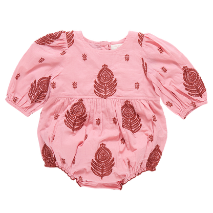 The Pink Chicken Baby Girls' Brooke Embroidered Bubble is a charming pink romper with long sleeves, adorned with red peacock feather designs. Made from 100% cotton, this cozy outfit features intricate All Over Indian Embroidery, making it an ideal addition to your little one's wardrobe.