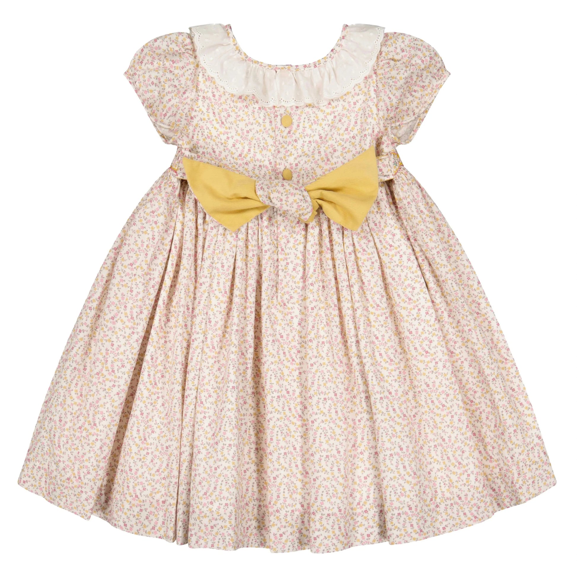 The Antoinette Baby Girls' and Girls' Isadora Short Sleeve Floral Smocked Dress features an elegant floral pattern, white ruffled collar, front buttons, and a large yellow bow at the waist.