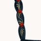 Close-up of the blue poplin Lima Mini Dress strap by Agua By Agua Bendita, featuring hand-embroidered leaves and red floral accents along a straight neckline.