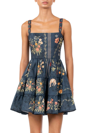 Agua By Agua Bendita Lima Mini Dress in navy blue, a tiered poplin style with a square neckline and a colorful floral and animal print.