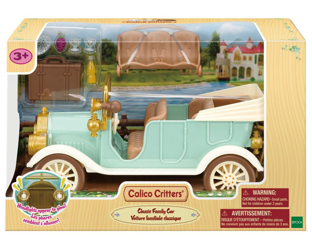 A boxed Calico Critters Classic Family Car, featuring toy car accessories and seating for up to 10 figures. Suitable for ages 3 and up. Warning labels are displayed in the bottom right corner.