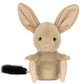 The Jellycat Jerboa plush is a small rodent-like stuffed animal with large ears, beige fur, a round body, and a black-tipped tail, shown sitting upright against a white background.