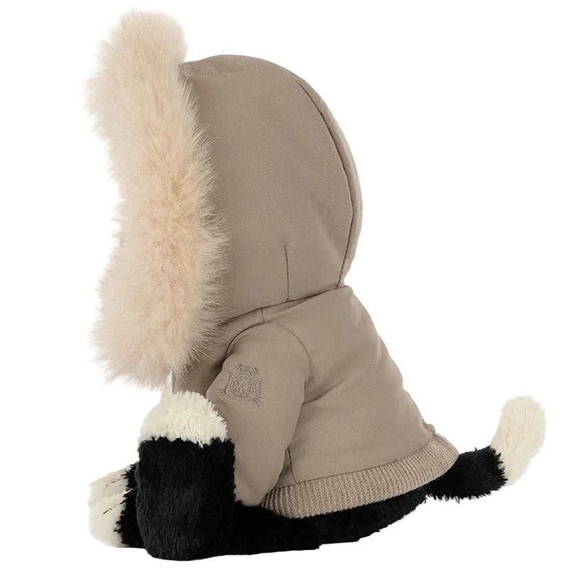Jellycat Jack ‘Alpine’ plush cat in black and white, wearing a tan hooded jacket with a faux-fur trim.