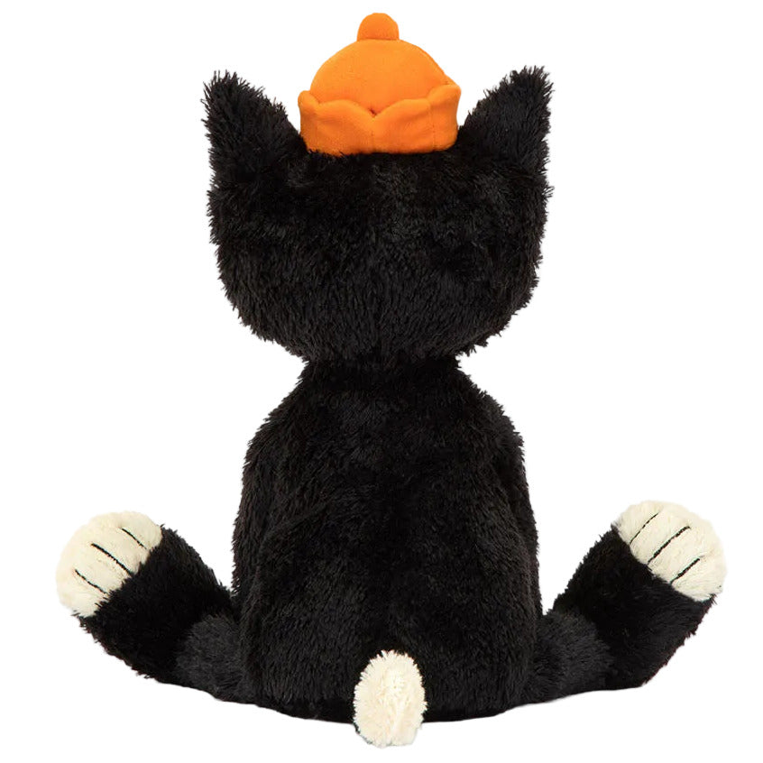 Jellycat Jack Huge, a 24" plush tuxedo cat by Jellycat, sits with legs apart, sporting an orange hat, soft tufty fur, and a small white tail visible from behind.