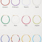 Twelve Jia Jia Birthstone Bracelets arranged in a grid, labeled by month from January to December, each featuring different colors and semi-precious gemstones.