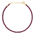 Introducing the Jia Jia Birthstone Bracelet by acclaimed brand Jia Jia, featuring small, round dark red semi-precious gemstones and a refined 14 karat gold clasp.