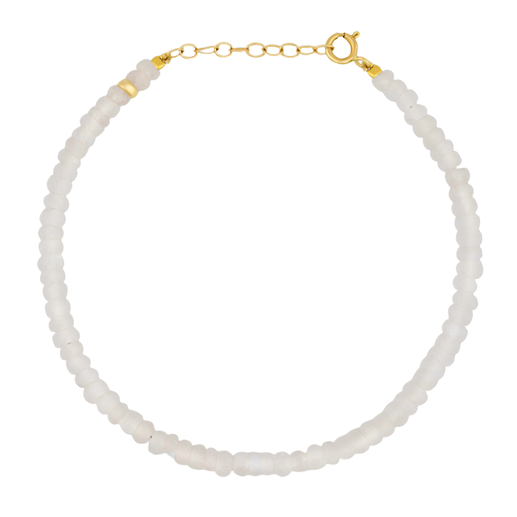 Presenting the Jia Jia Birthstone Bracelet, a stunning piece crafted with small, round white beads and featuring a 14 karat gold clasp by the renowned brand Jia Jia.