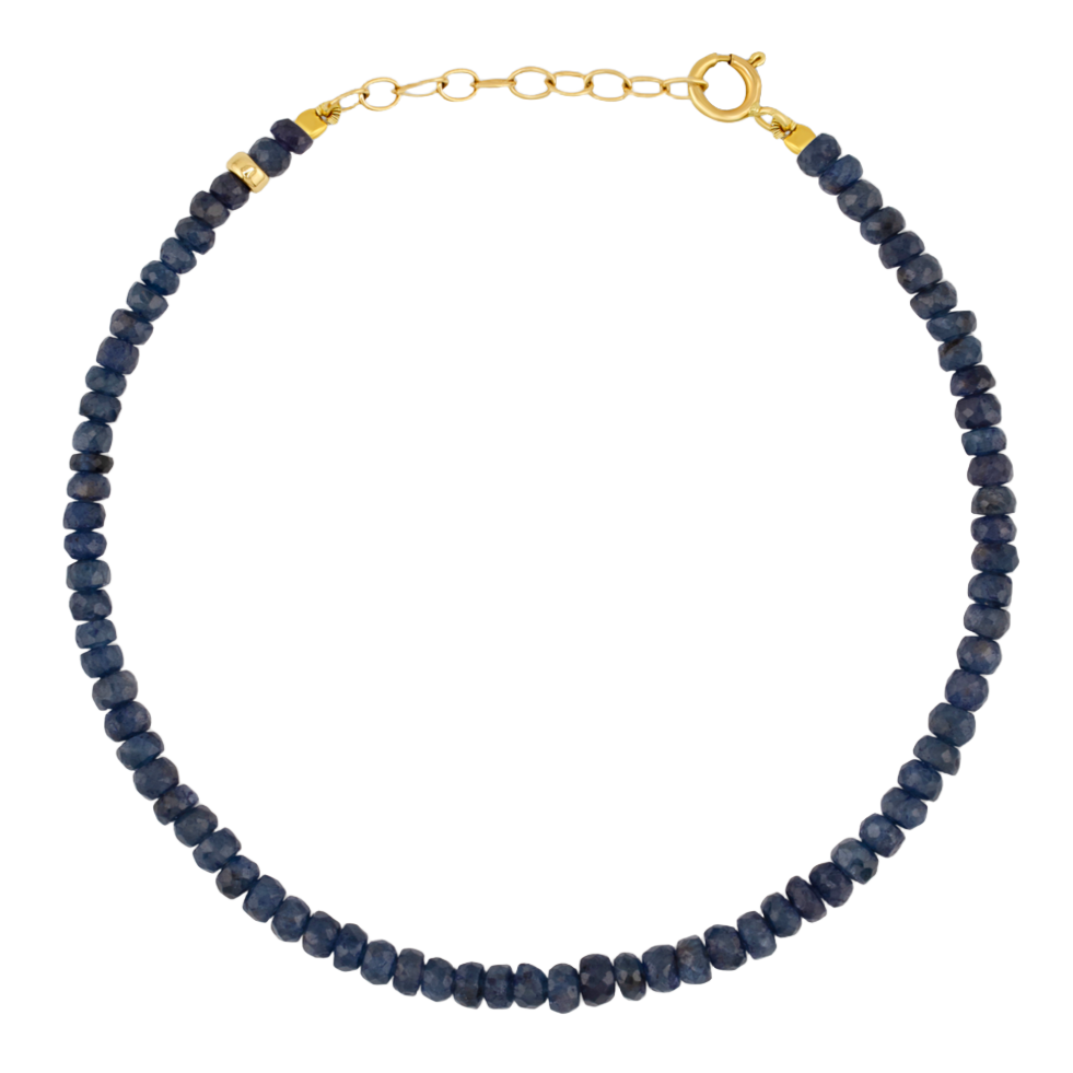 Jia Jia's Birthstone Bracelet by Jia Jia features dark blue beads and a 14 karat gold-tone clasp with an extender chain.