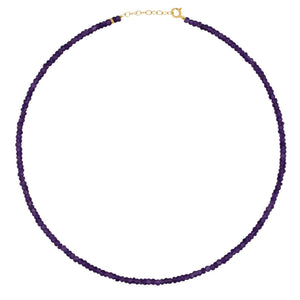 The Jia Jia Birthstone Necklace from the brand Jia Jia is an elegant thin string necklace, embellished with small purple semi-precious gemstones and finished with a 14 karat gold clasp.