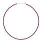 The Jia Jia Birthstone Necklace by the brand Jia Jia is a delicate necklace featuring purple beads and a 14 karat gold clasp.