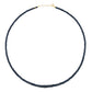 The Jia Jia Birthstone Necklace by Jia Jia gracefully features a slender design with black beads and semi-precious gemstones, completed with a 14 karat gold clasp, artistically positioned in a circular shape on a white background.