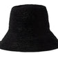 A black Janessa Leone Felix Hat made of raffia straw isolated on a white background.