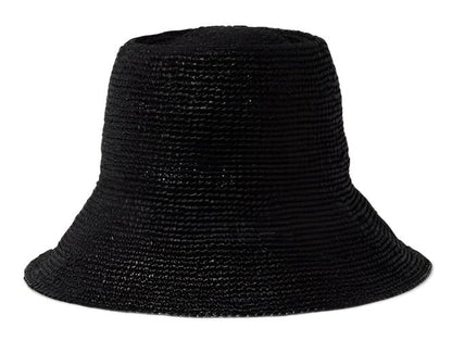 A black Janessa Leone Felix Hat made of raffia straw isolated on a white background.