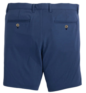 Back view of Johnnie-O Jupiters Stretch Cotton Performance Shorts in blue, featuring two back pockets with button closures, belt loops at the waistband, and crafted from performance fabric for added comfort.