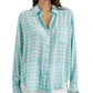 Woman wearing a turquoise and white plaid Rails Josephine Top with a collar and front buttons, paired with white pants.