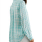 A woman in a Rails Josephine Top, a light blue and white checkered button-down shirt viewed from the back, focusing on the shirt's design and fit.