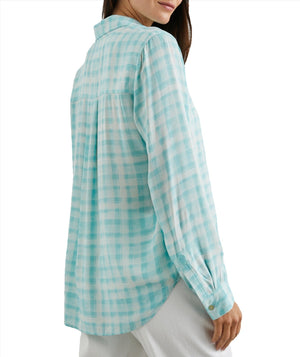 A woman in a Rails Josephine Top, a light blue and white checkered button-down shirt viewed from the back, focusing on the shirt's design and fit.