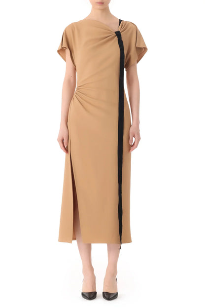 Person wearing a Jason Wu Collection Draped Neck Fluid Crepe Dress in latte with short sleeves, an asymmetrical neckline, and a black vertical stripe. The Jason Wu Collection dress features a side slit and is paired with black pointed-toe heels.