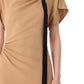 A person wearing the Jason Wu Collection's Draped Neck Fluid Crepe Dress in tan, featuring a black vertical stripe and artfully draped fabric on one side.