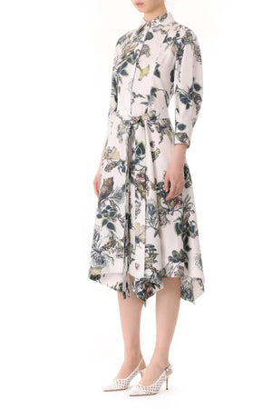 A person wearing a white floral Jason Wu Collection Forest Floral Silk Twill Shirtdress with three-quarter-length sleeves and a belt. They are also wearing white high-heeled shoes.