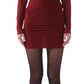 A person wearing a Jason Wu LS Double Layer Ruched Dress, black tights, and black shoes stands against a plain white background.