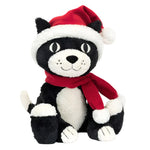 The Jellycat Christmas Jellycat Jack, by the brand Jellycat, is a black and white plush cat featuring a red Santa hat and scarf, making it the ideal festive stuffed animal for the holiday season.