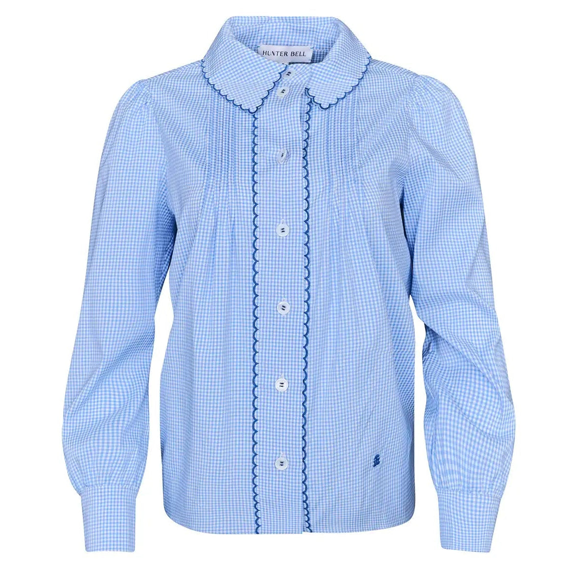 The James Shirt by Hunter Bell NYC is a light blue, long-sleeve button-down with a Saltwater Check gingham pattern, scalloped collar, and decorative trim on the front placket.