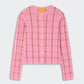 The Jane Checker Cardigan by Guest in Residence is a pink, long-sleeve, button-up cashmere cardigan with a brown windowpane check, shown on a light background.