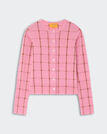 The Jane Checker Cardigan by Guest in Residence is a pink, long-sleeve, button-up cashmere cardigan with a brown windowpane check, shown on a light background.